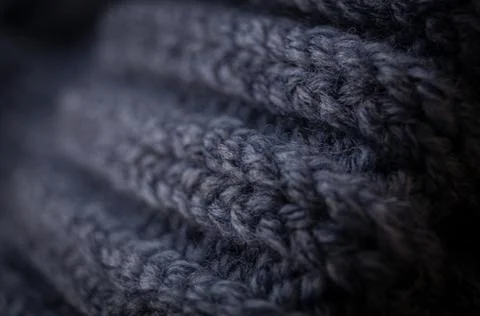 Close-up of the texture of a handmade knitted sweater. Rows of loops. Stock Photos