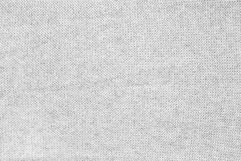 Close up texture of light gray woven fabric with a subtle pattern of evenly Stock Photos
