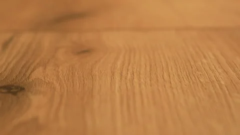 Close up texture of light wooden table top with natural pattern. Part of the Stock Footage 303473476