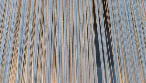 Close up texture of a lot of threads in a weaving machine called a loom Foto stock