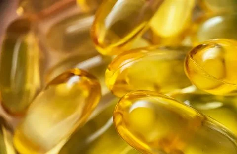 Close-up texture of many omega 3 capsules. Polyunsaturated fatty acids. The Stock Photos