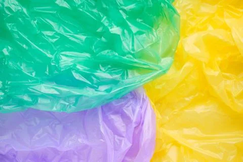 Close up Texture of a multicolor Plastic garbage Bag. Green Poly Stock Photos