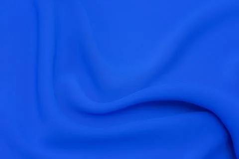Close-up texture of natural blue fabric or cloth in same color. Fabric textur Stock Photos