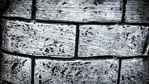 Close-up texture of an old gray brick wall with a cracked surface Stock Photos