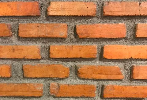 Close up texture of old orange brick wall for background Stock Photos