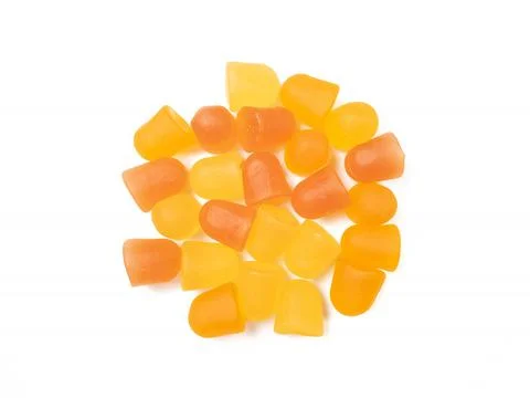 Close-up texture of orange and yellow multivitamin gummies. Healthy lifestyle Stock Photos
