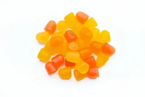 Close-up texture of orange and yellow multivitamin gummies in the form of bears Stock Photos