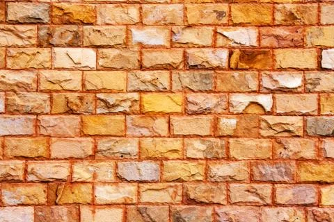 Close up texture of orange brick wall Photos