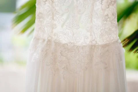 Close-up of the texture of the pattern of the bride s dress at the waist o... Foto stock