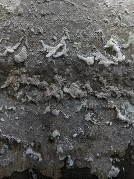 Close-up texture of peeling paint and weathered concrete wall 스톡 사진