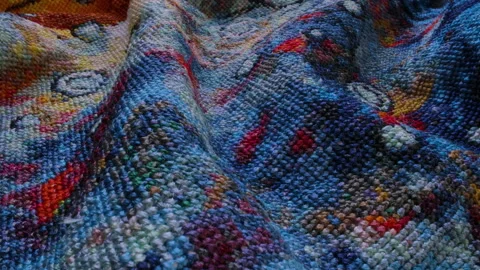 Close-up of the texture of the picture embroidered with colored threads Stock Footage 166903006