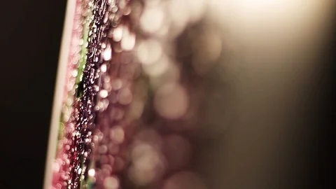 Close up texture pink flowera on the canvas painting oil in dark art studio Stock Footage 98261553