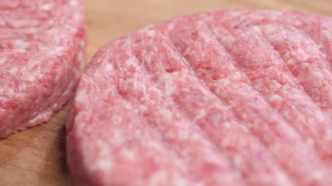 Close up texture of a raw burger patty. Production of fast food. Stock Footage 222617244