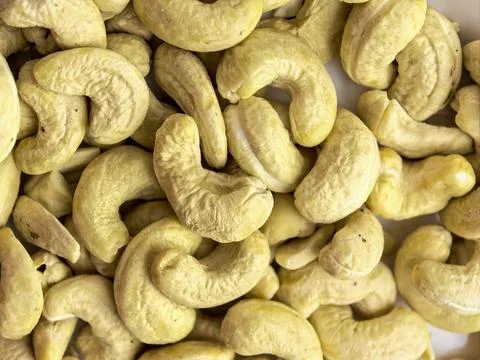 Close up texture of raw cashew nuts arranged across the frame. Healthy natu.. 写真素材