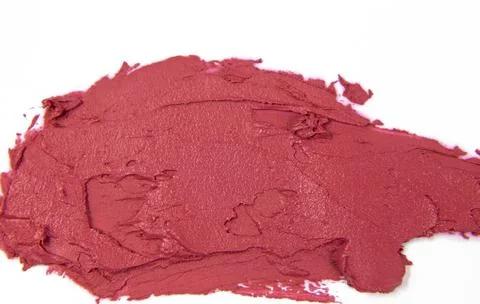 Close-up of the texture of red lipstick. A sample of lipstick on a white Stock Photos