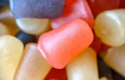 Close-up texture of red, orange and purple multivitamin gummies. Healthy Stock Photos