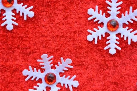 Close up texture of red wool textile background with white snowflake, chris.. Stock Photos