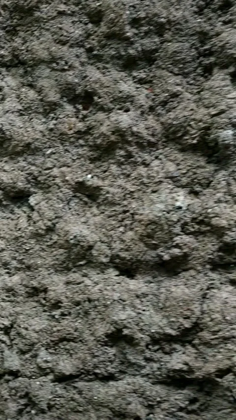 Close-up texture of a rough concrete wall with uneven surface. Stock Footage 318709116