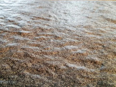 Close-up texture of rough natural stone surface with wavy ripples Stock Photos