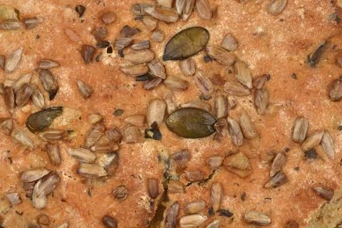 Close Up Texture of Seeded Whole Grain Bread Crust Stock Photos