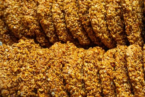 Close up texture of sesame coated Arabic cookies traditional bakery background Stock Photos