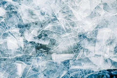 Close-up texture of shattered ice in varying shades of blue and white. The .. Stock Photos
