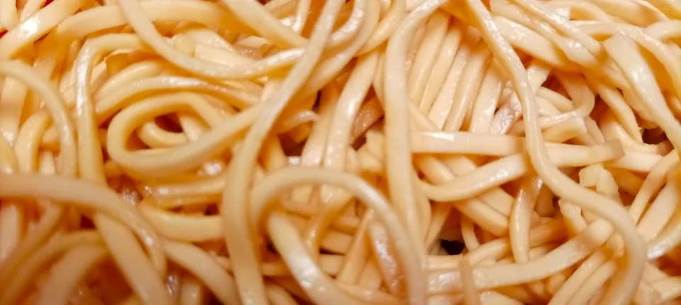 A close-up texture shot of plain cooked spaghetti noodle Stock Photos