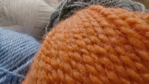 Close-up of the texture of skeins of colored yarn Stock Footage 166902800