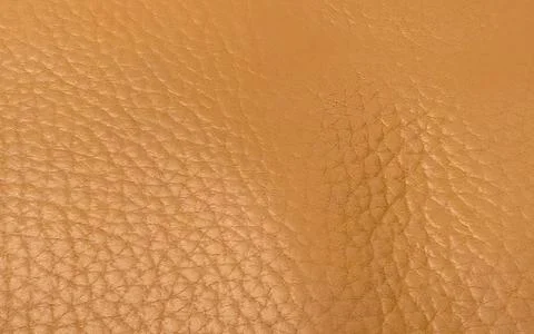 Close-up texture of smooth tan leather for fashion and furniture design bac.. Stock Photos