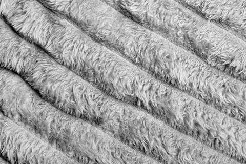 Close up texture of soft, fluffy gray fleece fabric with diagonal folds. Perfect 写真素材