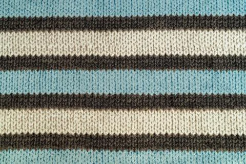 Close up texture of soft striped fabric featuring blue, white, brown lines. T Stock Photos