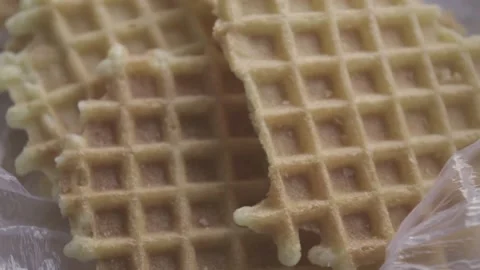 Close up texture of sweet crispy homemade waffles delicious snack in plastic bag Stock Footage 161855545