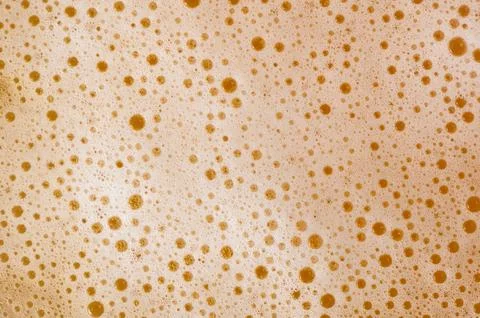 Close-up texture of thick beer foam with bubbles Stock Photos