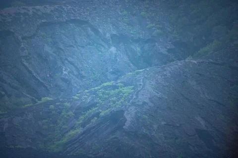 Close-up Texture of Volcanic Ash Slopes with Emerging Greenery Stock Photos