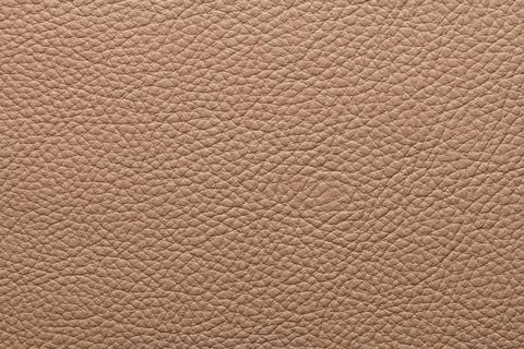 Close-up texture of warm camel beige pebbled leather grain Stock Photos