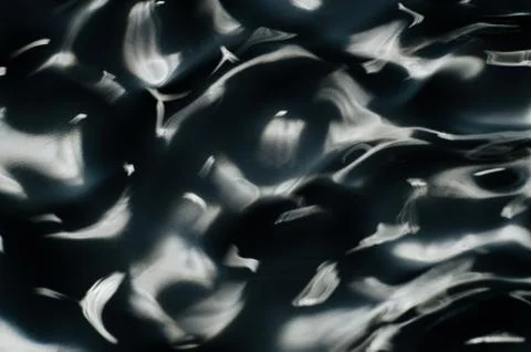 Close up texture of water under the influence of vibration in 432 hertz Stock Photos