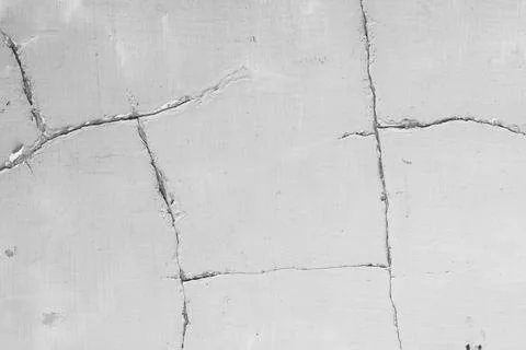 Close-up texture of weathered gray concrete wall with visible cracks and da.. Stock Photos