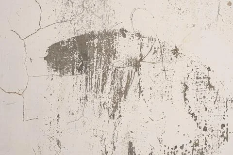 Close-up texture of weathered gray concrete wall with visible cracks and da.. Photos