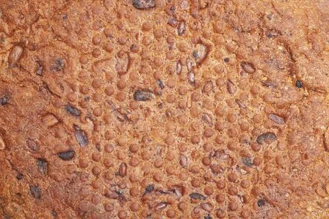 Close-up texture of white bread crust with seeds Stock Photos