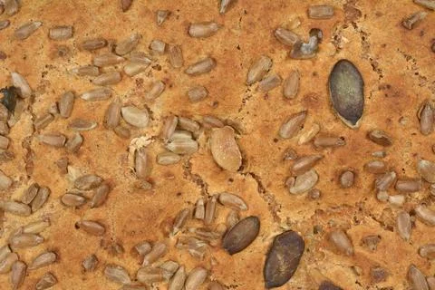 Close up texture of whole grain bread crust with seeds Stock Photos