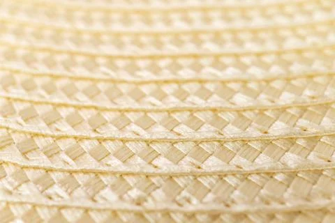 Close-up texture of woven straw material in soft light Stock Photos