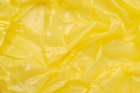 Close up Texture of a Yellow Plastic garbage Bag. Yellow Polyeth Stock Photos