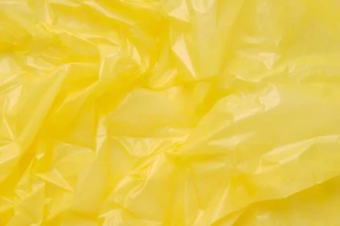 Close up Texture of a Yellow Plastic garbage Bag. Yellow Polyeth Stock Photos