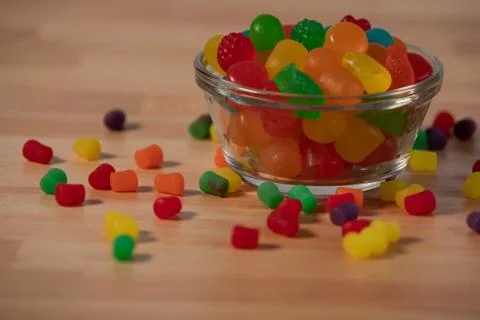 Close up textured background candy sweet pieces scattered Stock Photos