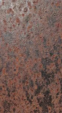 Close up textured background of rough rusty metal surface with pitting Фото