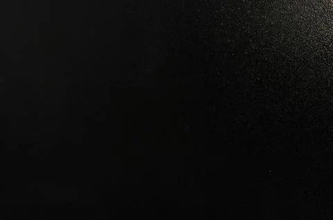 Close-up of textured black surface with fine grain and subtle sparkle, Stock Photos