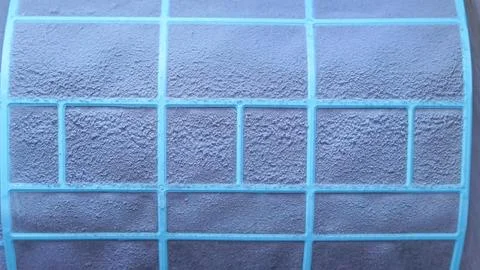 Close-up of textured blue filter with grid pattern for air conditioning unit Photos