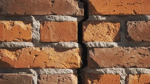 Close up textured brick wall with a visible crack Video stock 333719004