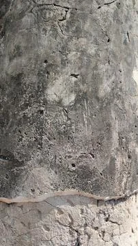 Close-up of textured concrete surface, showcasing natural wear and unique p.. Stock Photos