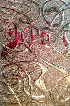 Close up of textured glass pattern with colored reflections. Foto stock